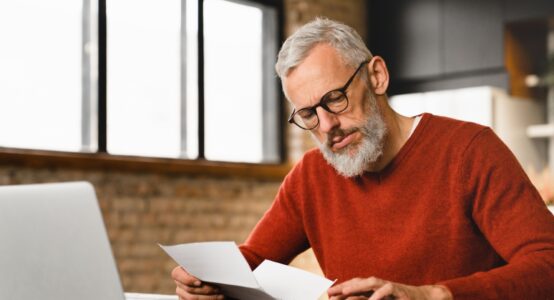 A man reading some paperwork.