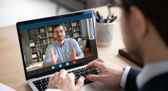 Someone using Zoom to talk to a person.
