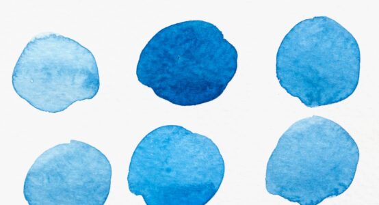 A set of six watercolour blue circles in different shades.