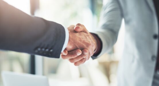Two people shaking hands.