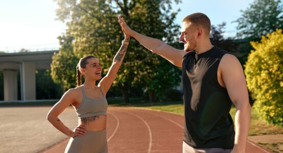 A couple on a running track.