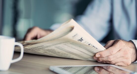 A man reading a newspaper.