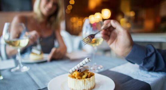A couple enjoying a meal in a restaurant.