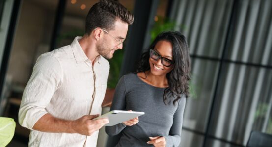 Two employees chatting together.